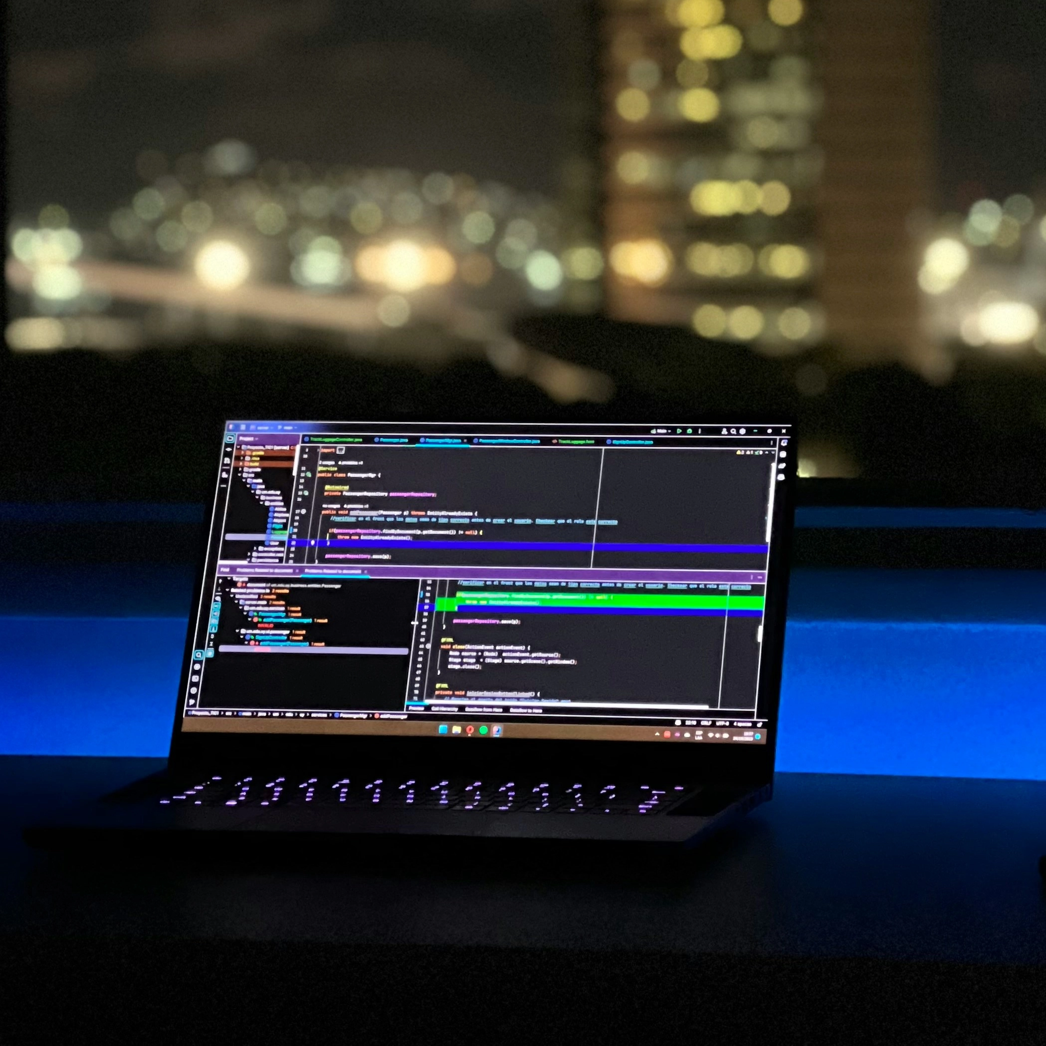 A photograph of a software testing services on a laptop overlooking London