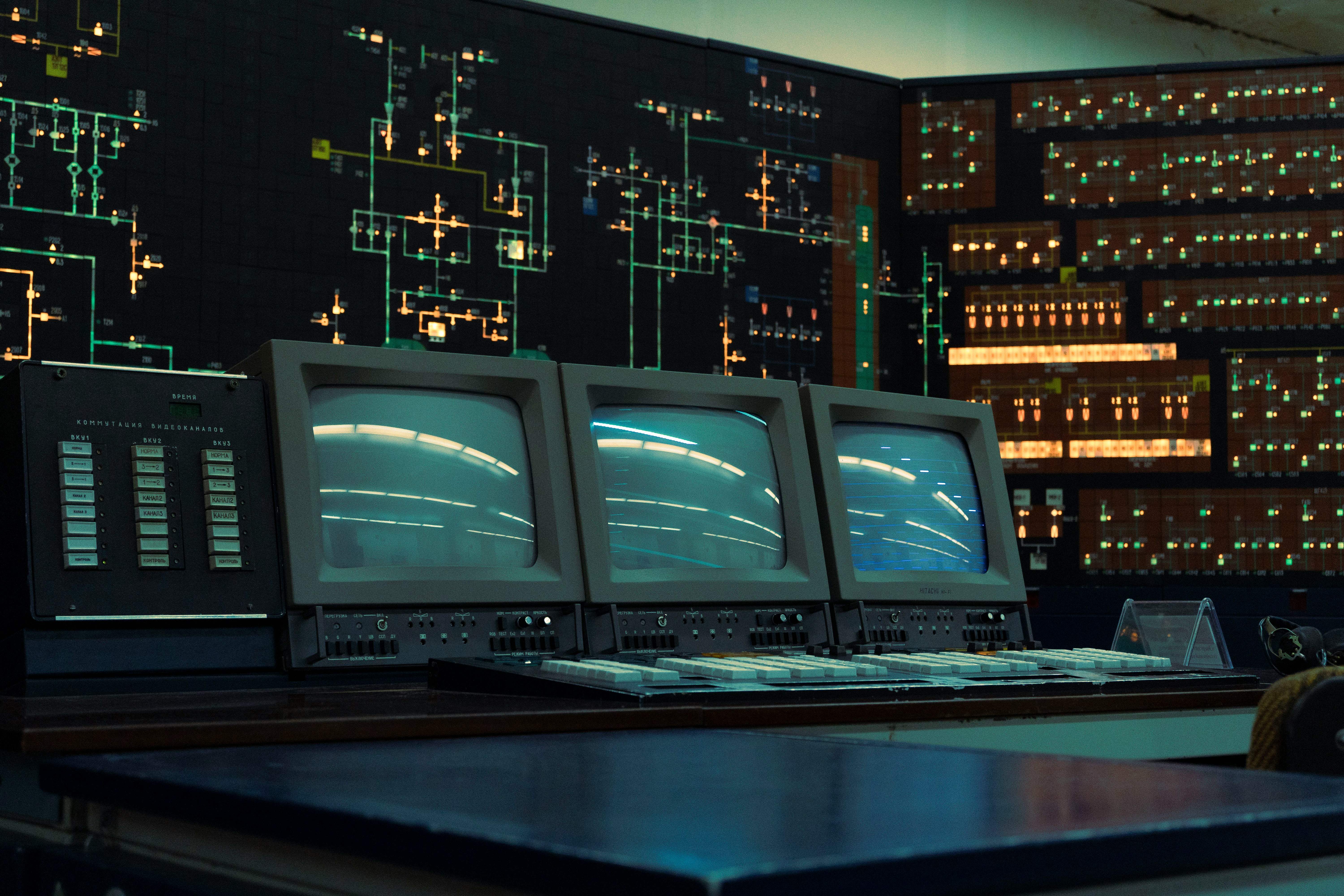 An old legacy system with a large switch board in the background.